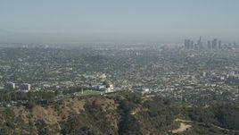 4.8K aerial stock footage Griffith Observatory with a view of Downtown Los Angeles skyline, California Aerial Stock Footage | AX68_004