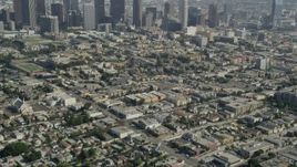 4.8K aerial stock footage tilt from Westlake neighborhood to reveal Downtown Los Angeles, California Aerial Stock Footage | AX68_011