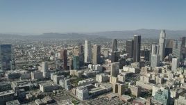 4.8K stock footage video of passing tall Downtown Los Angeles skyscrapers in California on a sunny day Aerial Stock Footage | AX68_018