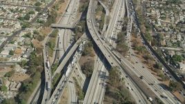 4.8K aerial stock footage of a bird's eye view of heavy traffic on the East Los Angeles Interchange through Boyle Heights, Los Angeles, California Aerial Stock Footage | AX68_029