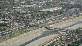4.8K aerial stock footage approach the Los Angeles River and Interstate 710 in Bell Gardens, Los Angeles, California Aerial Stock Footage | AX68_038