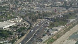4.8K aerial stock footage approach traffic backing up on Interstate 710 in Bell Gardens, Los Angeles, California Aerial Stock Footage | AX68_039