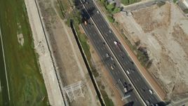 4.8K aerial stock footage of a bird's eye view of light traffic on I-710 through South Gate, Los Angeles, California Aerial Stock Footage | AX68_043