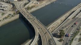4.8K aerial stock footage tilt from 710 freeway and Los Angeles River to reveal Downtown Long Beach, California Aerial Stock Footage | AX68_049