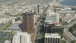 4.8K aerial stock footage follow Ocean Boulevard between office buildings in Downtown Long Beach, California Aerial Stock Footage | AX68_055