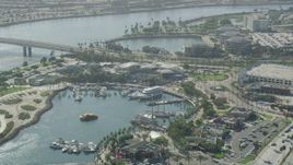 4.8K aerial stock footage of Aquarium of the Pacific and boats on Rainbow Harbor in Downtown Long Beach, California Aerial Stock Footage | AX68_060