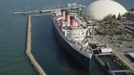 4.8K aerial stock footage of passing the starboard side of the Queen Mary luxury liner in Long Beach, California Aerial Stock Footage | AX68_065