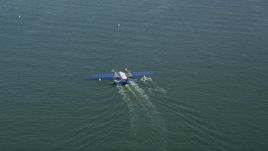 4.8K aerial stock footage of tracking a seaplane on San Pedro Bay, Long Beach, California Aerial Stock Footage | AX68_072