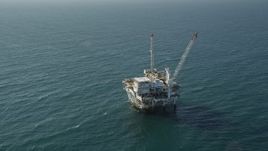 4.8K aerial stock footage of circling an oil platform off the California Coast, near Long Beach Aerial Stock Footage | AX68_100