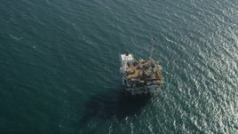 4.8K aerial stock footage of bird's eye view of an oceanic oil platform off the California Coast near Long Beach Aerial Stock Footage | AX68_102