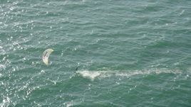 4.8K aerial stock footage of tracking a kite surfer cruising across San Pedro Bay, Long Beach, California Aerial Stock Footage | AX68_119