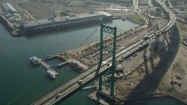4.8K aerial stock footage of light traffic crossing Vincent Thomas Bridge at the Port of Los Angeles in California Aerial Stock Footage | AX68_150