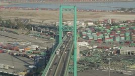 4.8K aerial stock footage of traffic on the Vincent Thomas Bridge near Port of Los Angeles shipping containers, California Aerial Stock Footage | AX68_152