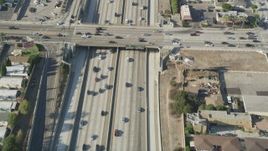 4.8K aerial stock footage bird's eye view of cars traveling on Interstate 110 through Carson, California Aerial Stock Footage | AX68_178