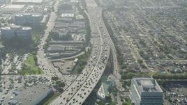 4.8K aerial stock footage of heavy traffic on I-405 between office buildings and homes in Torrance, California Aerial Stock Footage | AX68_184