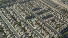 4.8K aerial stock footage tilt to a bird's eye view of tract homes in Gardena, California Aerial Stock Footage | AX68_185