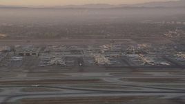 4.8K aerial stock footage of terminals and control tower at LAX at sunset, Los Angeles, California Aerial Stock Footage | AX69_007