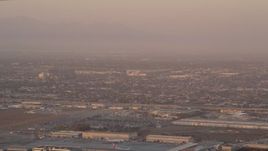 4.8K aerial stock footage track an airliner on approach to LAX at sunset, Los Angeles, California Aerial Stock Footage | AX69_010