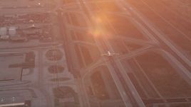 4.8K aerial stock footage track an airliner at sunset as it lands at LAX, Los Angeles, California Aerial Stock Footage | AX69_016