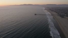 4.8K stock footage video approach Venice Fishing Pier on the California Coast at sunset Aerial Stock Footage | AX69_023
