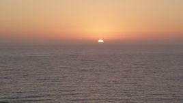 4.8K stock footage video of Pacific Ocean with the setting sun in the distance Aerial Stock Footage | AX69_026