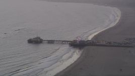 4.8K aerial stock footage of Santa Monica Pier at sunset with the Pacific Wheel lit up, California Aerial Stock Footage | AX69_029