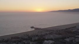 4.8K aerial stock footage approach Santa Monica Pier at sunset, California Aerial Stock Footage | AX69_031