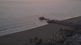 4.8K aerial stock footage of approaching Santa Monica Pier and Pacific Wheel at sunset, California Aerial Stock Footage | AX69_032