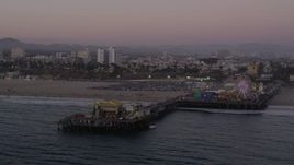 4.8K aerial stock footage orbit the end of Santa Monica Pier and the Pacific Wheel at twilight, California Aerial Stock Footage | AX69_035