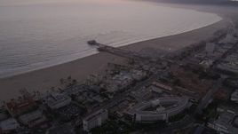 4.8K aerial stock footage approach Santa Monica Pier and the beach at twilight, California Aerial Stock Footage | AX69_040