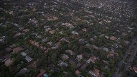 4.8K aerial stock footage fly over mansions and upscale homes at twilight in Brentwood, California Aerial Stock Footage | AX69_050