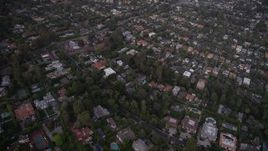 4.8K aerial stock footage of flying over mansions and upscale houses at twilight in Brentwood, California Aerial Stock Footage | AX69_051