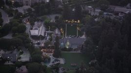 4.8K aerial stock footage orbit of The Playboy Mansion at twilight in Los Angeles, California Aerial Stock Footage | AX69_063