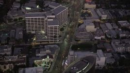 4.8K aerial stock footage fly over office buildings on Wilshire Boulevard in Beverly Hills, California, twilight Aerial Stock Footage | AX69_070