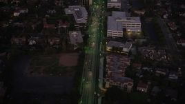 4.8K aerial stock footage office buildings on Wilshire Boulevard in the Mid-Wilshire area of Los Angeles, California at night Aerial Stock Footage | AX69_074