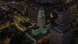 4.8K aerial stock footage orbit Los Angeles City Hall in Downtown Los Angeles, California at night Aerial Stock Footage | AX69_084