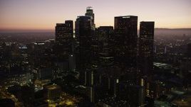 4.8K aerial stock footage tilt and approach skyscrapers in Downtown Los Angeles at twilight, California Aerial Stock Footage | AX69_087