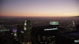4.8K aerial stock footage fly over Downtown Los Angeles skyscrapers to approach 777 Tower at twilight, California Aerial Stock Footage | AX69_090
