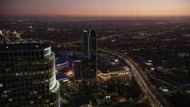 4.8K aerial stock footage flyby 777 Tower to reveal The Ritz-Carlton and Staples Center in Downtown Los Angeles at twilight, California Aerial Stock Footage | AX69_091