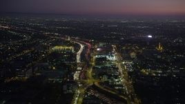 4.8K aerial stock footage of heavy traffic on Interstate 110 by University Park, Los Angeles, California at night Aerial Stock Footage | AX69_095