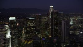 4.8K aerial stock footage approach the tall skyscrapers of Downtown Los Angeles, California at night Aerial Stock Footage | AX69_099
