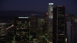 4.8K aerial stock footage fly between skyscrapers in Downtown Los Angeles, California at night Aerial Stock Footage | AX69_100