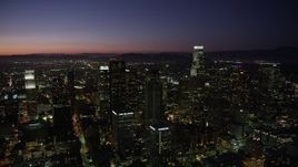 4.8K aerial stock footage pan across Downtown Los Angeles skyscrapers at night, California Aerial Stock Footage | AX69_110