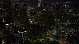 4.8K aerial stock footage tilt to reveal US Bank Tower and skyscrapers in Downtown Los Angeles at night, California Aerial Stock Footage | AX69_111