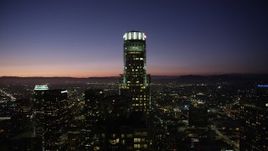 4.8K aerial stock footage orbit of US Bank Tower in Downtown Los Angeles at night, California Aerial Stock Footage | AX69_112
