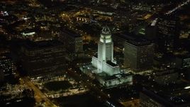 4.8K aerial stock footage of Los Angeles City Hall and courthouse in Downtown Los Angeles, California at nighttime Aerial Stock Footage | AX69_120