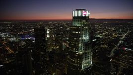 4.8K aerial stock footage flyby US Bank Tower and tops of Downtown Los Angeles, California skyscrapers at night Aerial Stock Footage | AX69_123