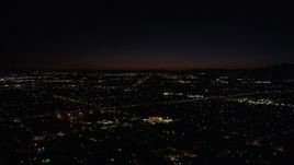4.8K aerial stock footage of suburban neighborhoods around I-5 at night in Arleta, California Aerial Stock Footage | AX69_155