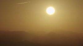 4K aerial stock footage View of the sunrise over the mountains Aerial Stock Footage | AX70_002