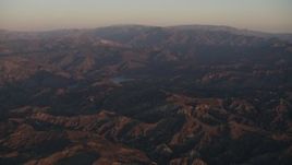 4K aerial stock footage Approach a lake in the Los Padres National Forest at sunrise, California Aerial Stock Footage | AX70_006